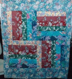 $Tsunami Tropical Charms Baby Quilt prior to quilting.jpg