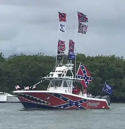 boat trump confederate flags lost causes.webp