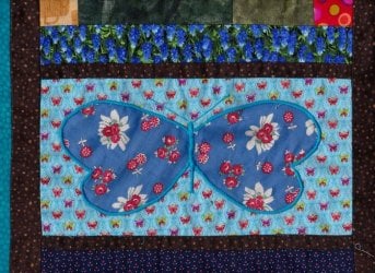 $Glad Rags and Longwings Quilt, Satin stitches9.jpg