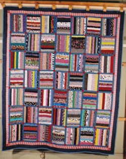 $Typing Paper Strip Pieced quilt for Wounded Soldier blue sash red set squares.jpg