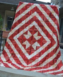 $Red White Log Cabin Star from Quilting Board dot com.jpg