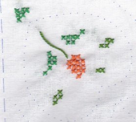 $Practice floral X-stitch hoop, first corner done.jpg