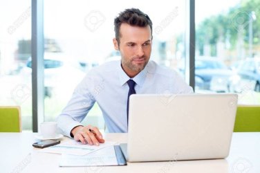 53959238-man-working-at-the-office-on-laptop.jpg